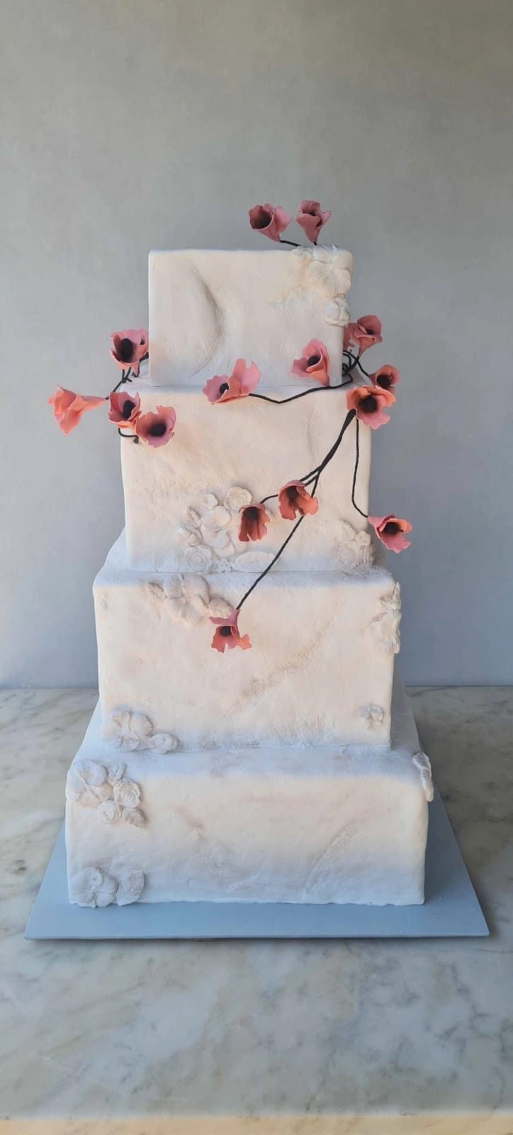 White wedding tier trailing blossom