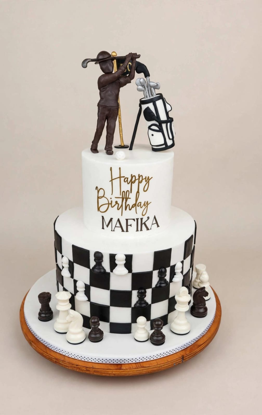 Two-tier chessboard cake with a fondant golfer and sugar chess pieces