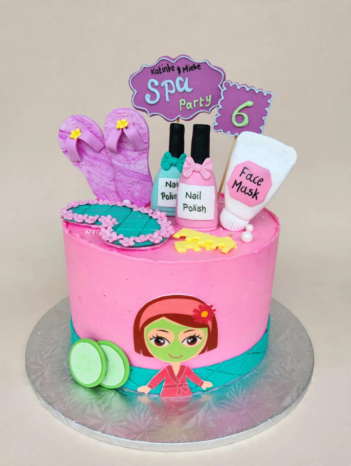 Pink spa party themed birthday cake with fondant nail polish and face mask