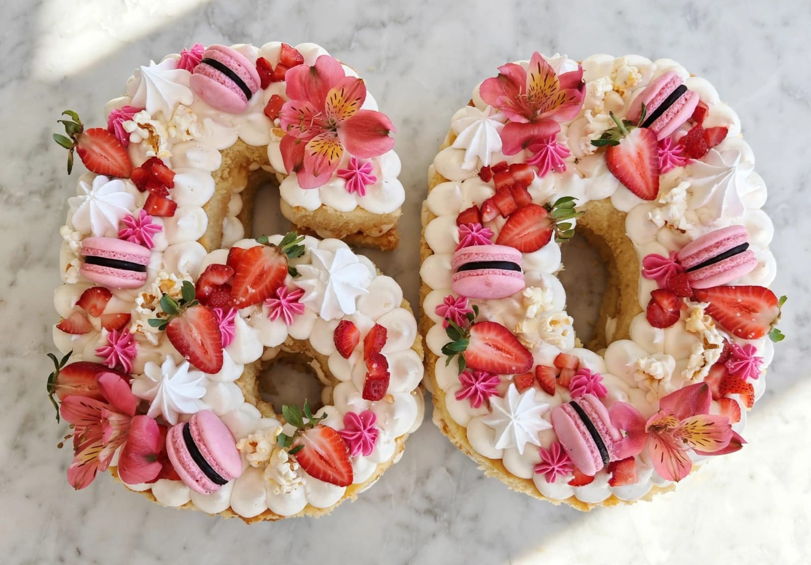 Number sixty cream tart with strawberries, macarons and meringues