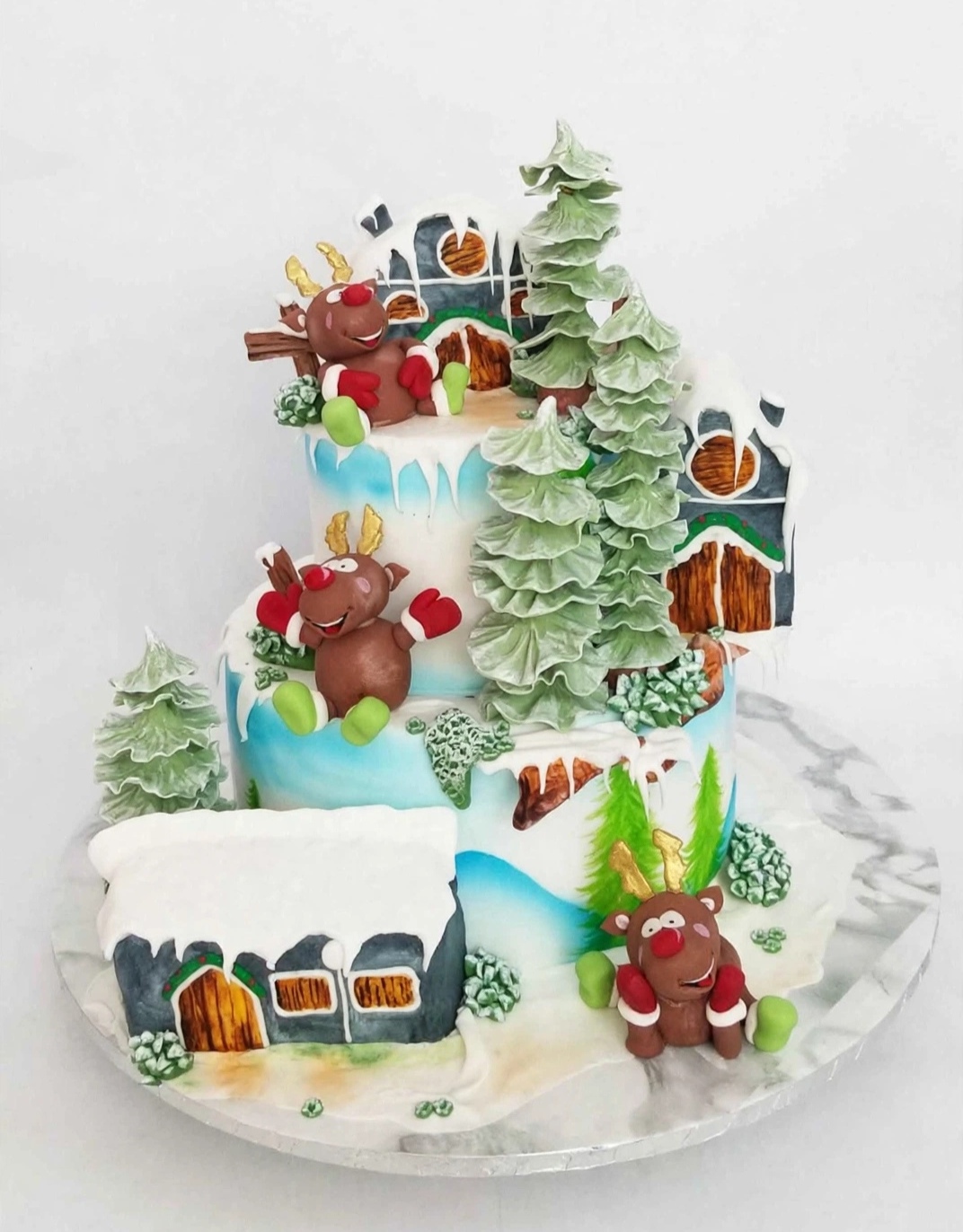 Winter wonderland celebration cake with reindeer