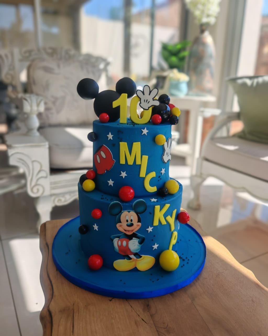 Two-tier navy Mickey Mouse birthday cake