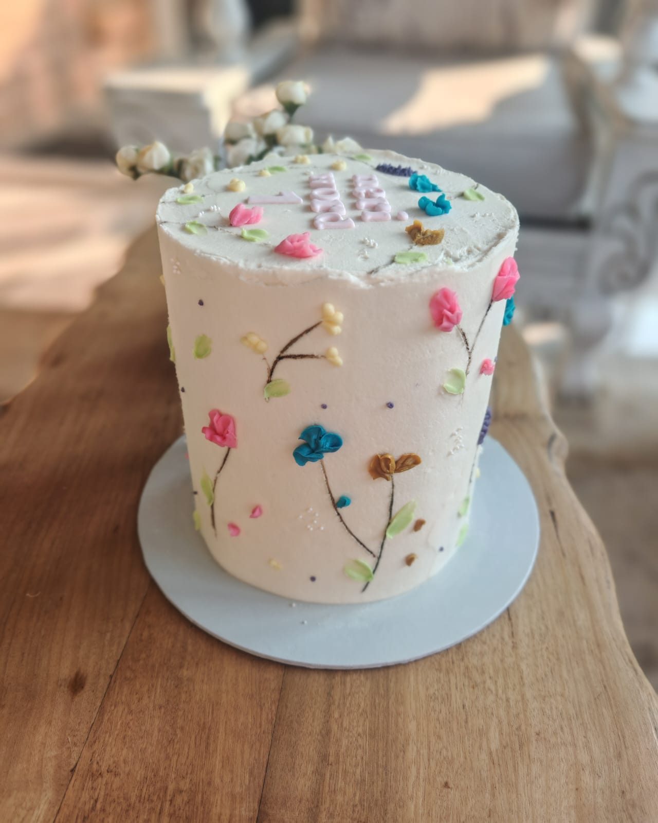Buttercream cake painted with wildflowers